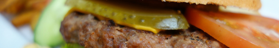 Eating American (Traditional) Burger Hot Dog at Jimmy's Texas Hots restaurant in Buffalo, NY.